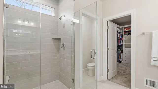 a bathroom with a sink a toilet and shower curtain