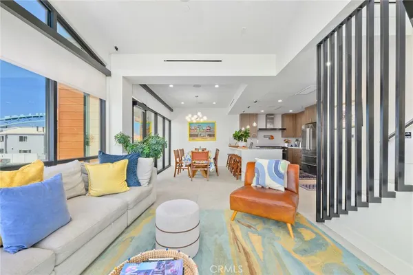 a living room with furniture and a rug
