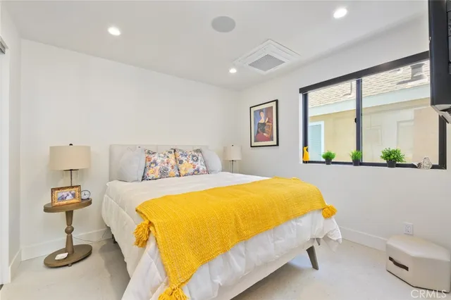 a bedroom with a bed and a table