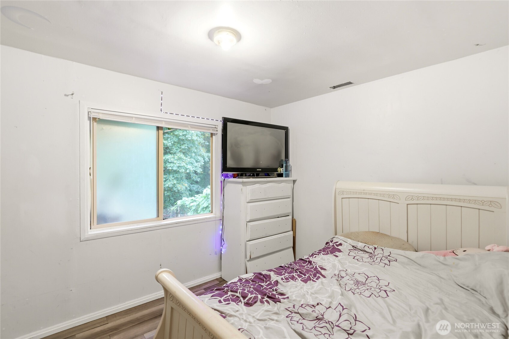 2861 Clare Avenue Bremerton, WA 98310 - Photo 12 of 39 a bedroom with a bed and flat screen tv