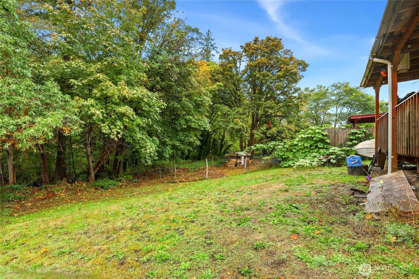 2861 Clare Avenue Bremerton, WA 98310 - Photo 20 of 39 a backyard of a house with lots of plants and tree