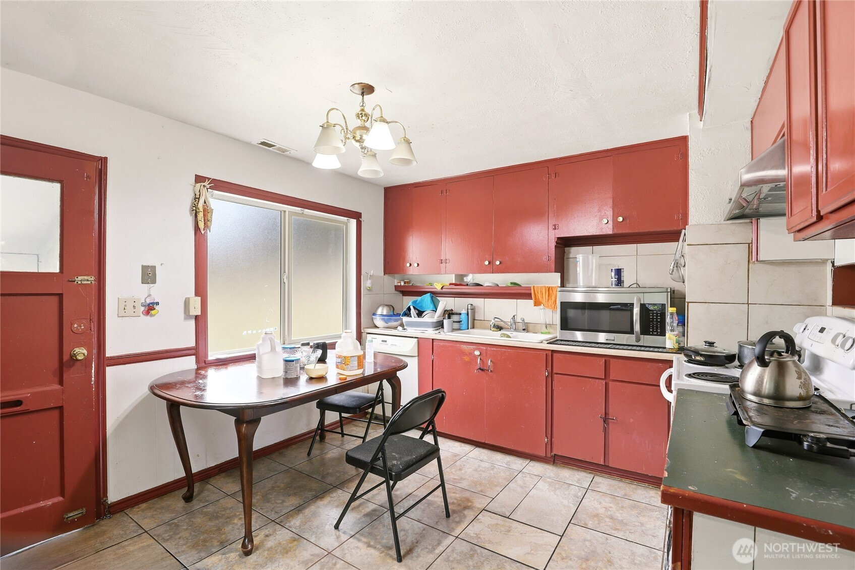 2861 Clare Avenue Bremerton, WA 98310 - Photo 25 of 39 a room with stainless steel appliances kitchen island granite countertop furniture a rug and a kitchen view
