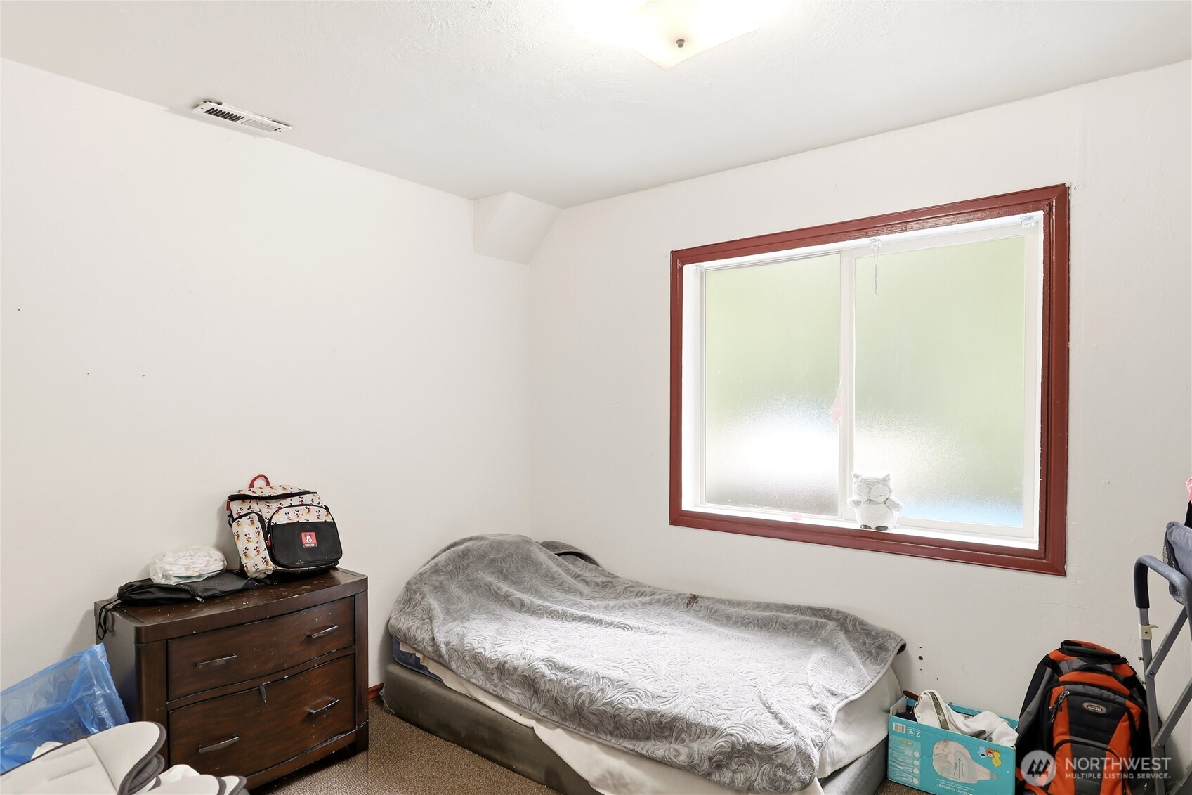 2861 Clare Avenue Bremerton, WA 98310 - Photo 28 of 39 a bedroom with a bed and a window