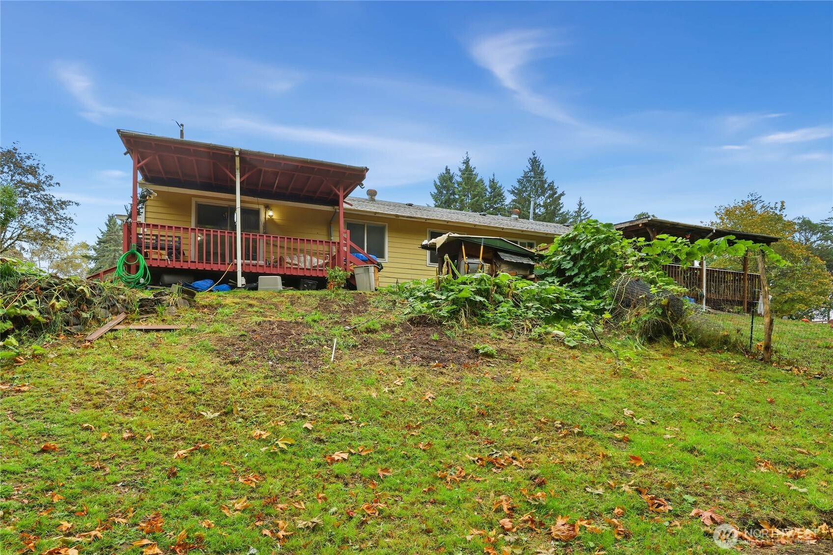 2861 Clare Avenue Bremerton, WA 98310 - Photo 35 of 39 a backyard of a house with yard and outdoor seating