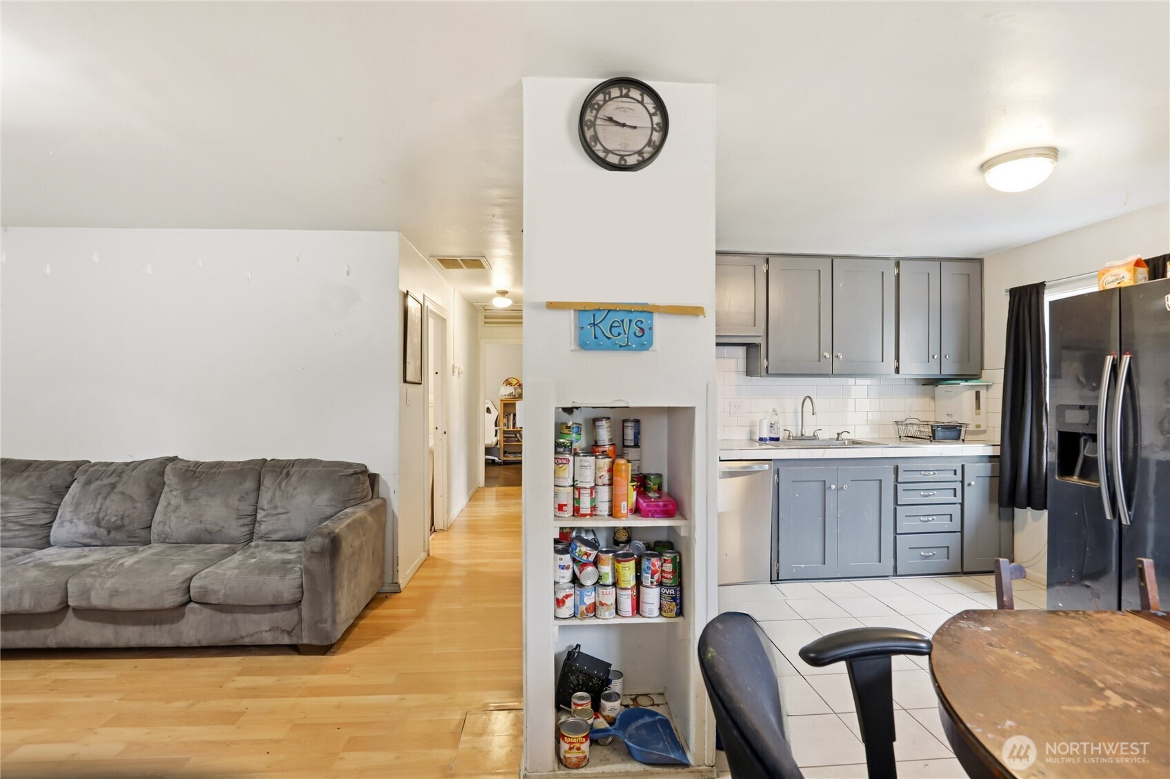 2861 Clare Avenue Bremerton, WA 98310 - Photo 6 of 39 a living room with stainless steel appliances furniture a rug and a window