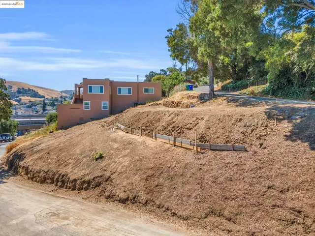 a view of a road with a building in the background
