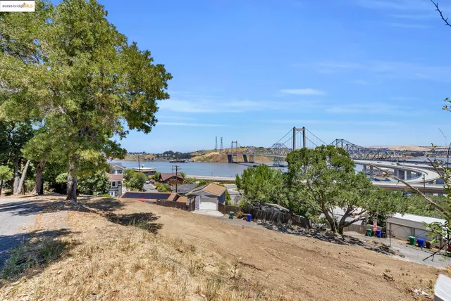 a view of a town with palm trees