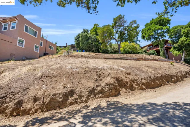 a view of a backyard of a house