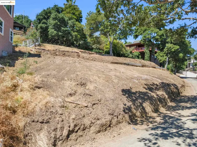 a view of a backyard of a house