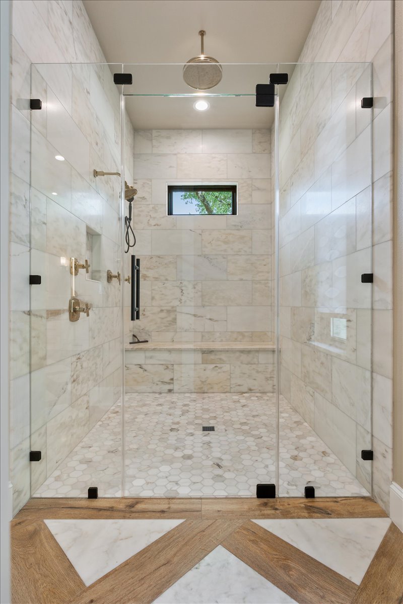 309 Highland Spring Lane Georgetown, TX 78633 - Photo 24 of 40 Walk-in Shower with soap insert, bench, & window for natural light...