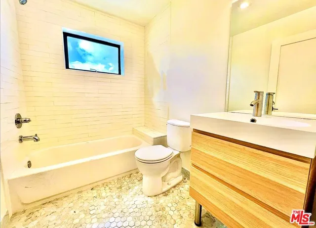 a bathroom with a sink and a bathtub