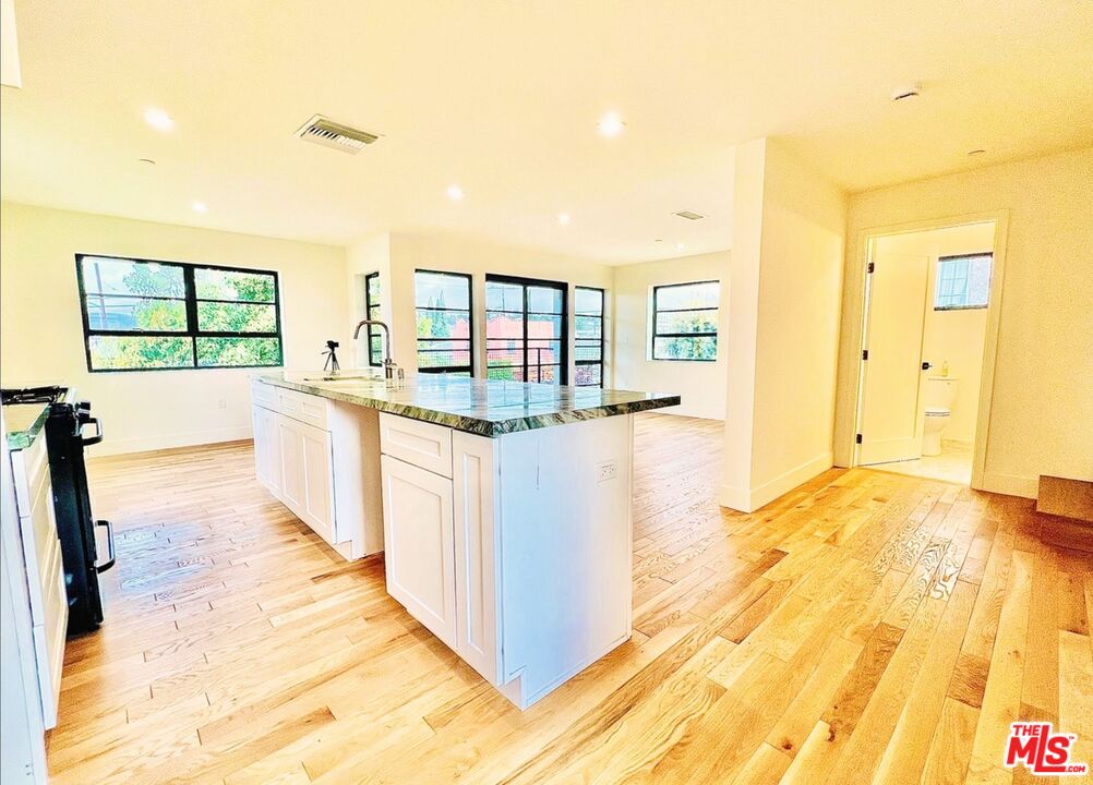 4152 1/2 Rogers Street, Unit 1/2 Los Angeles, CA 90063 - Photo 6 of 21 a bathroom with a tub sink and mirror