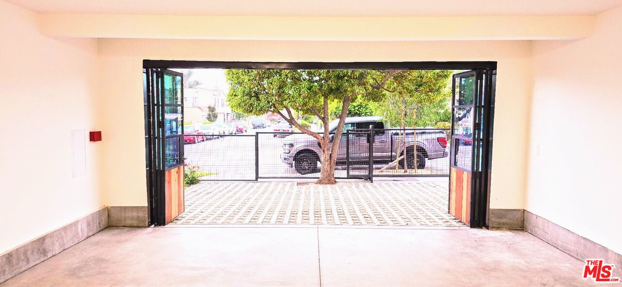 4152 1/2 Rogers Street, Unit 1/2 Los Angeles, CA 90063 - Photo 9 of 21 a view of a living room hardwood floor and a large window