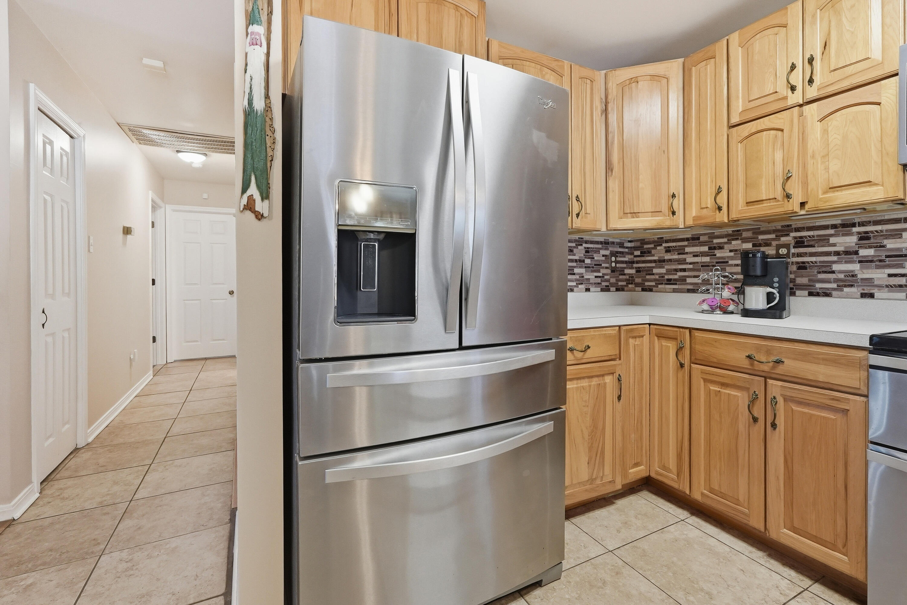 675 Spring Lake Road DeFuniak Springs, FL 32433 - Photo 21 of 91 a kitchen with stainless steel appliances granite countertop a refrigerator and a sink