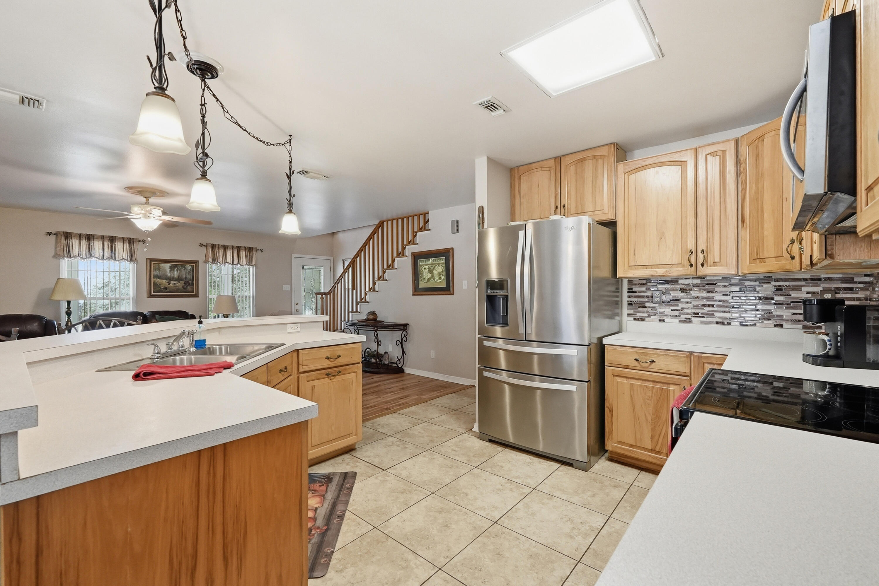 675 Spring Lake Road DeFuniak Springs, FL 32433 - Photo 23 of 91 a kitchen with stainless steel appliances granite countertop a refrigerator stove and sink