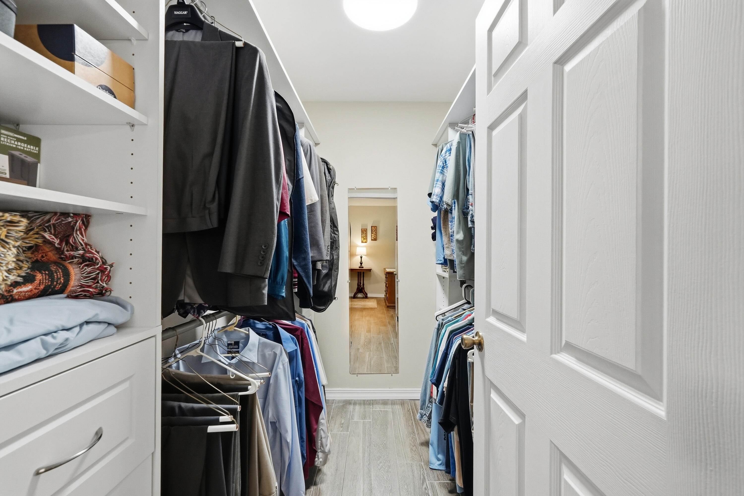 675 Spring Lake Road DeFuniak Springs, FL 32433 - Photo 34 of 91 a view of walk in closet with clothes and shoes