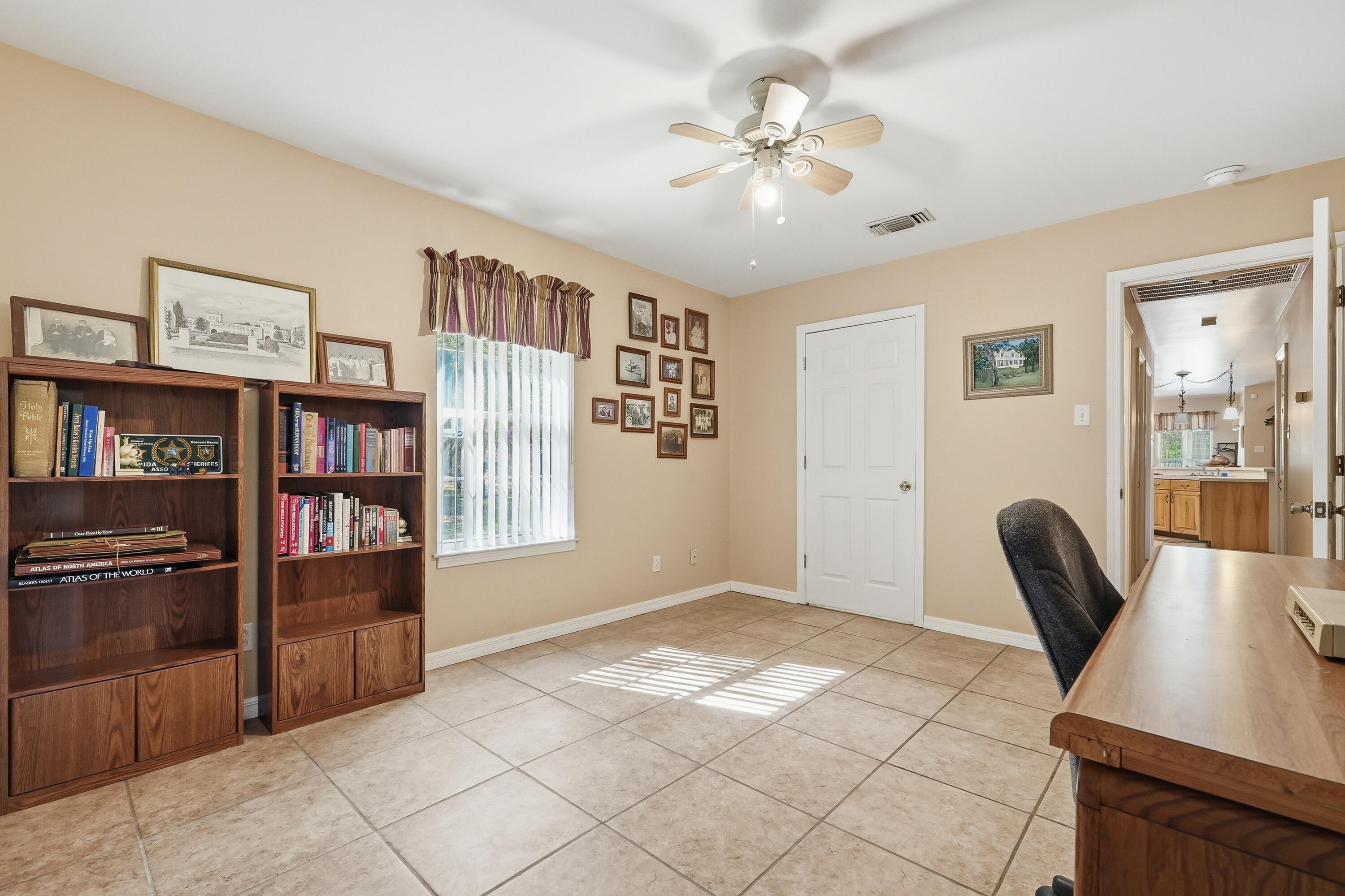 675 Spring Lake Road DeFuniak Springs, FL 32433 - Photo 36 of 91 a view of an empty room with window and cabinet
