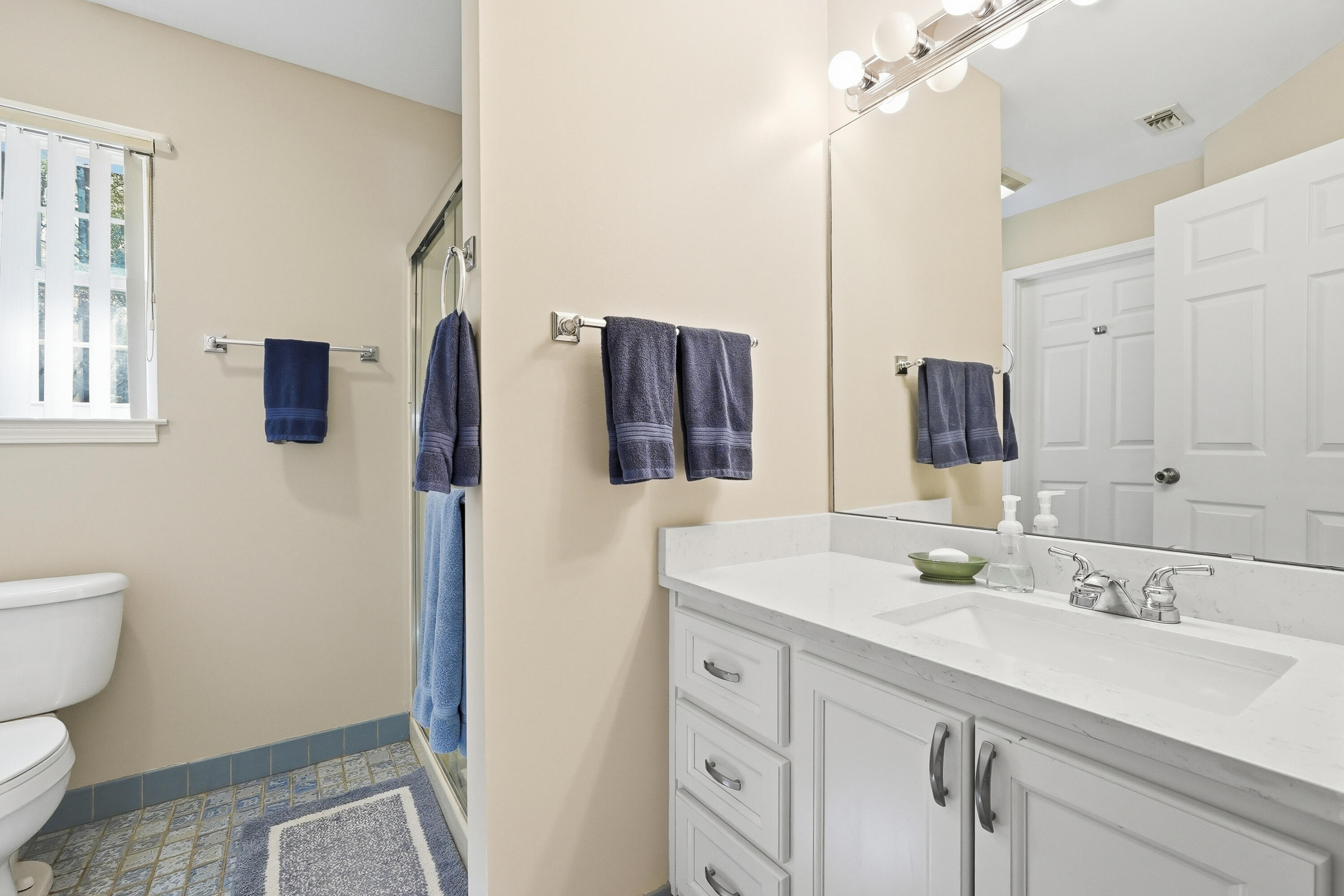 675 Spring Lake Road DeFuniak Springs, FL 32433 - Photo 38 of 91 a bathroom with a sink toilet double vanity and shower