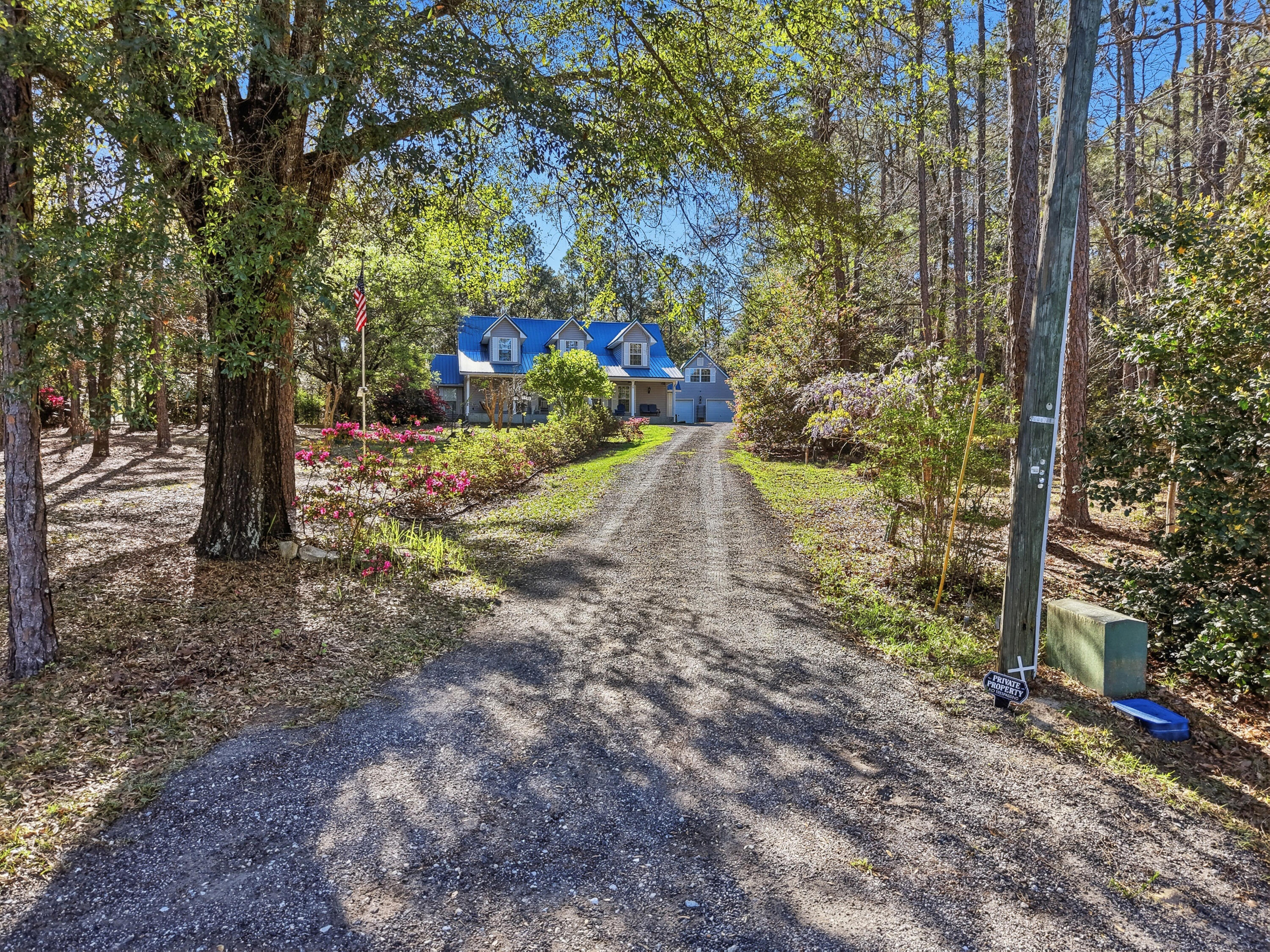 675 Spring Lake Road DeFuniak Springs, FL 32433 - Photo 4 of 91 a view of a yard with plants and trees