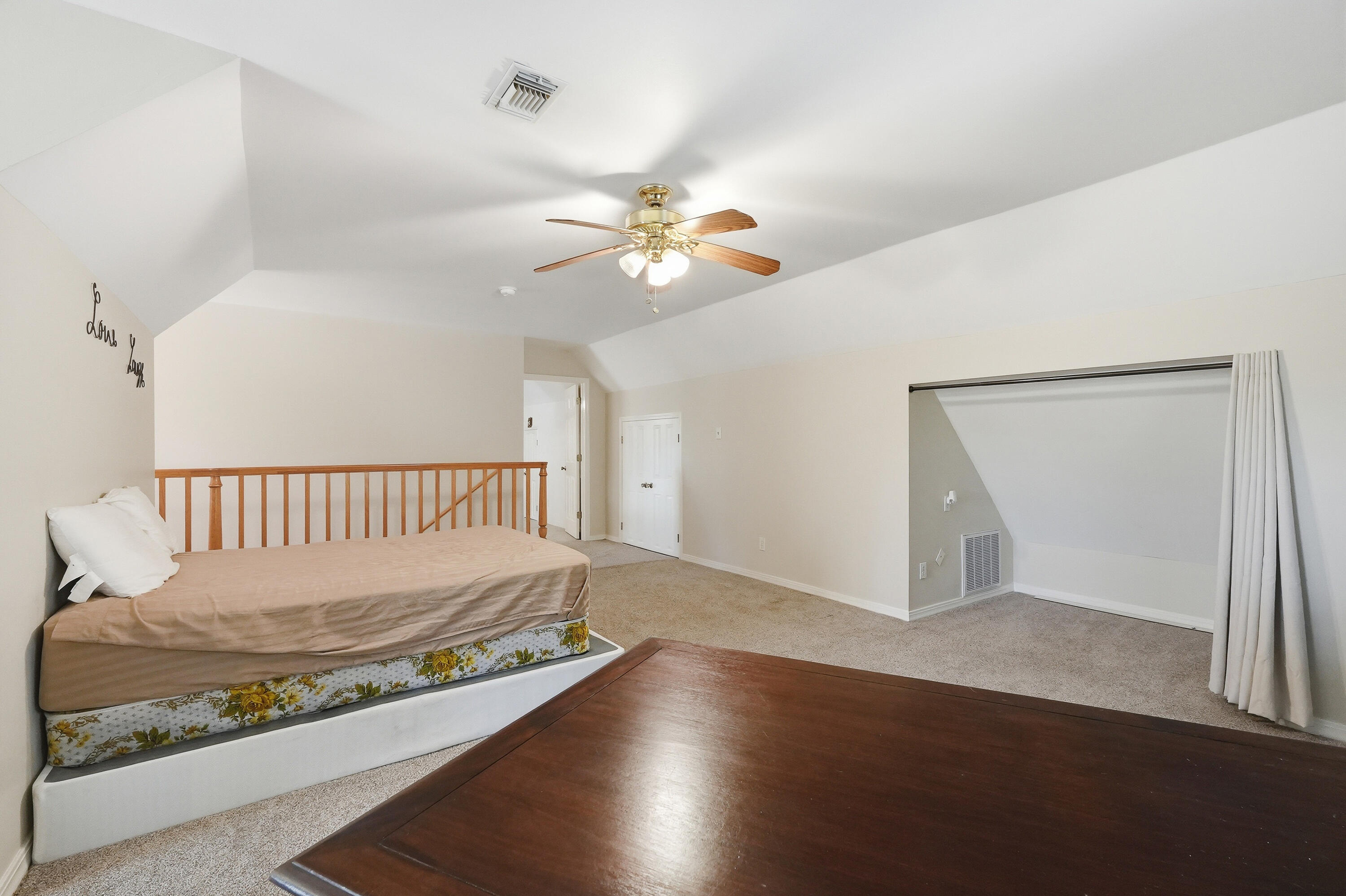 675 Spring Lake Road DeFuniak Springs, FL 32433 - Photo 44 of 91 a view of a room with a ceiling fan and wooden floor