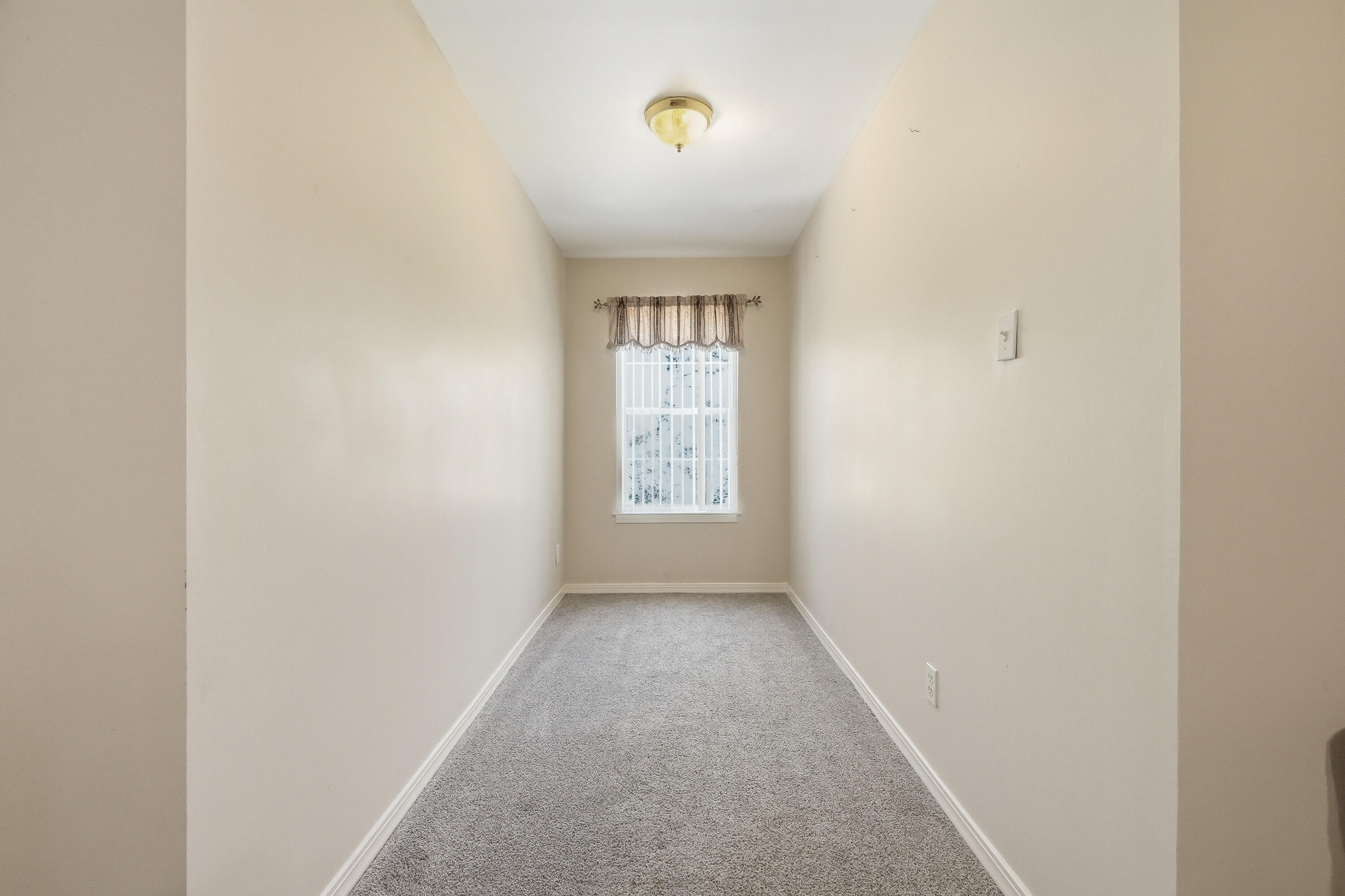675 Spring Lake Road DeFuniak Springs, FL 32433 - Photo 46 of 91 a view of an empty room with a window