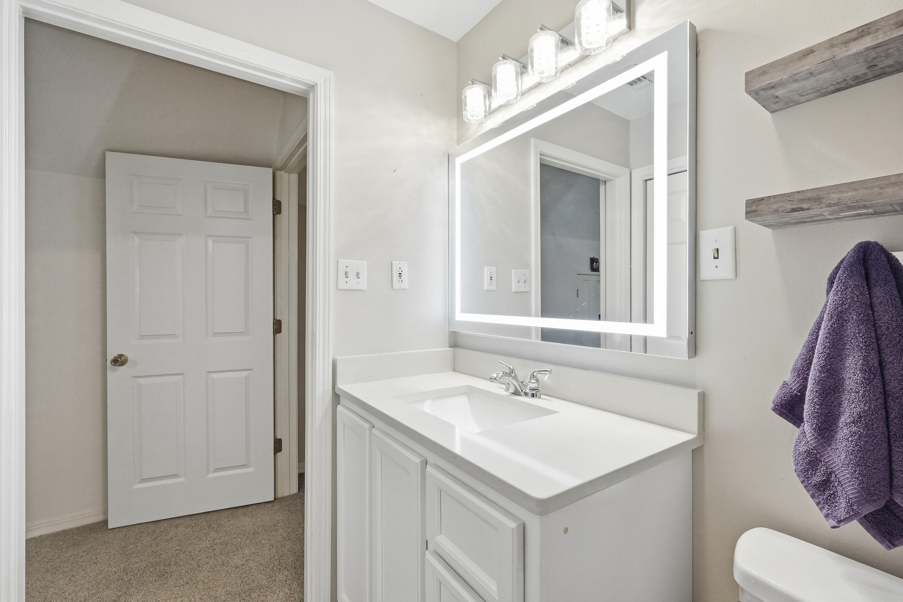 675 Spring Lake Road DeFuniak Springs, FL 32433 - Photo 49 of 91 a bathroom with a sink vanity and a mirror