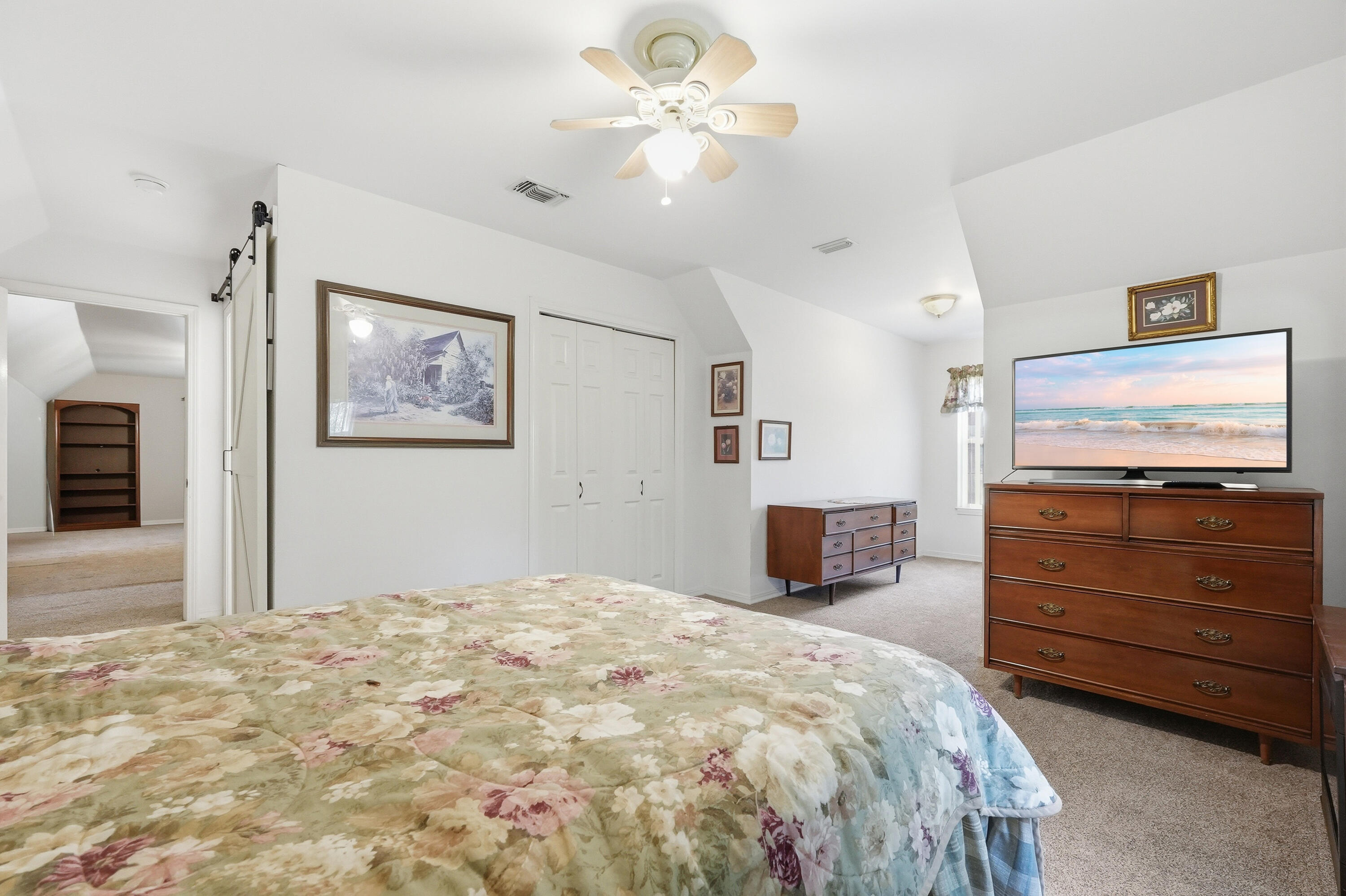 675 Spring Lake Road DeFuniak Springs, FL 32433 - Photo 54 of 91 a bedroom with a bed and a flat screen tv