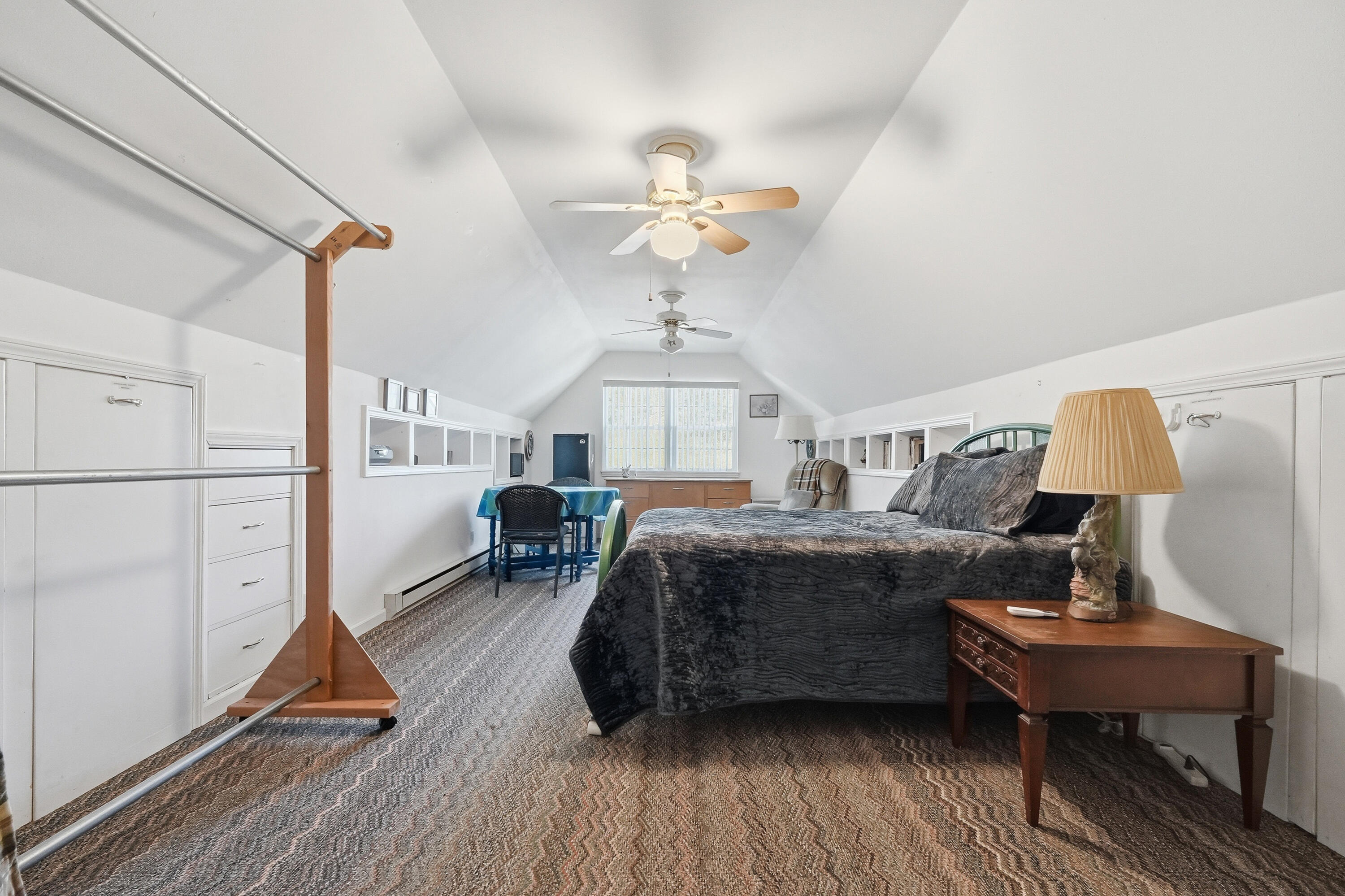 675 Spring Lake Road DeFuniak Springs, FL 32433 - Photo 55 of 91 a bedroom with furniture and a chandelier