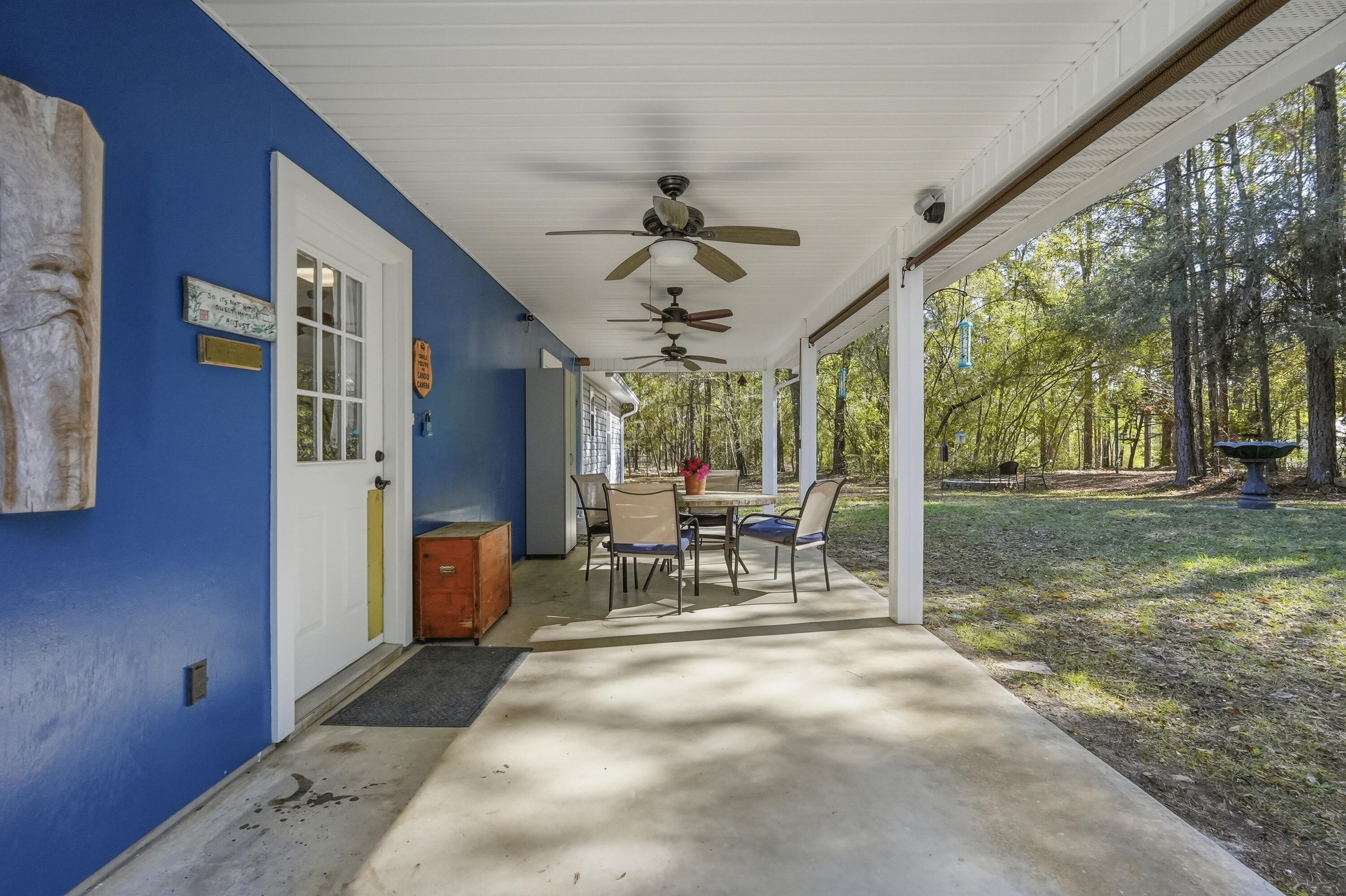 675 Spring Lake Road DeFuniak Springs, FL 32433 - Photo 63 of 91 a view of a porch with chairs and backyard