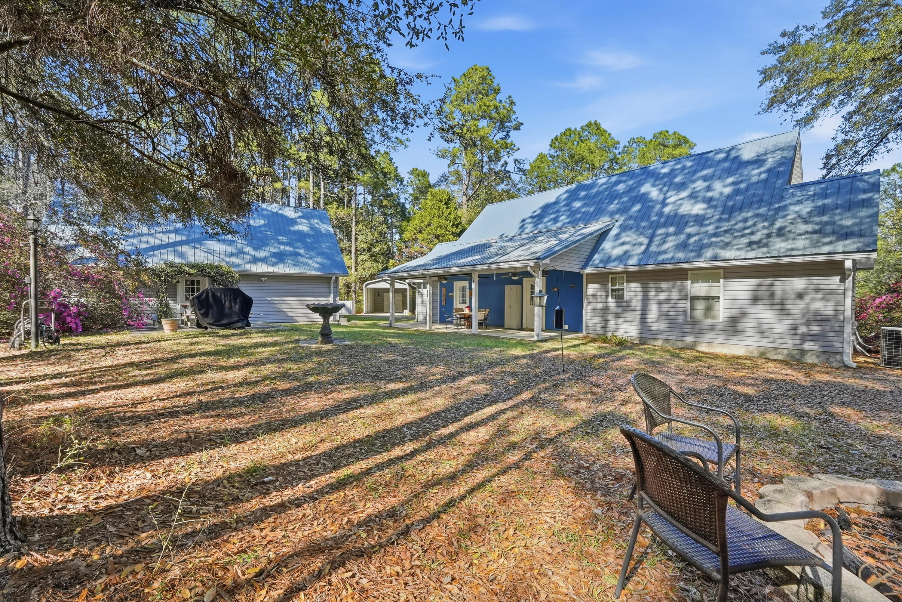675 Spring Lake Road DeFuniak Springs, FL 32433 - Photo 69 of 91 a view of a house with a yard and sitting area
