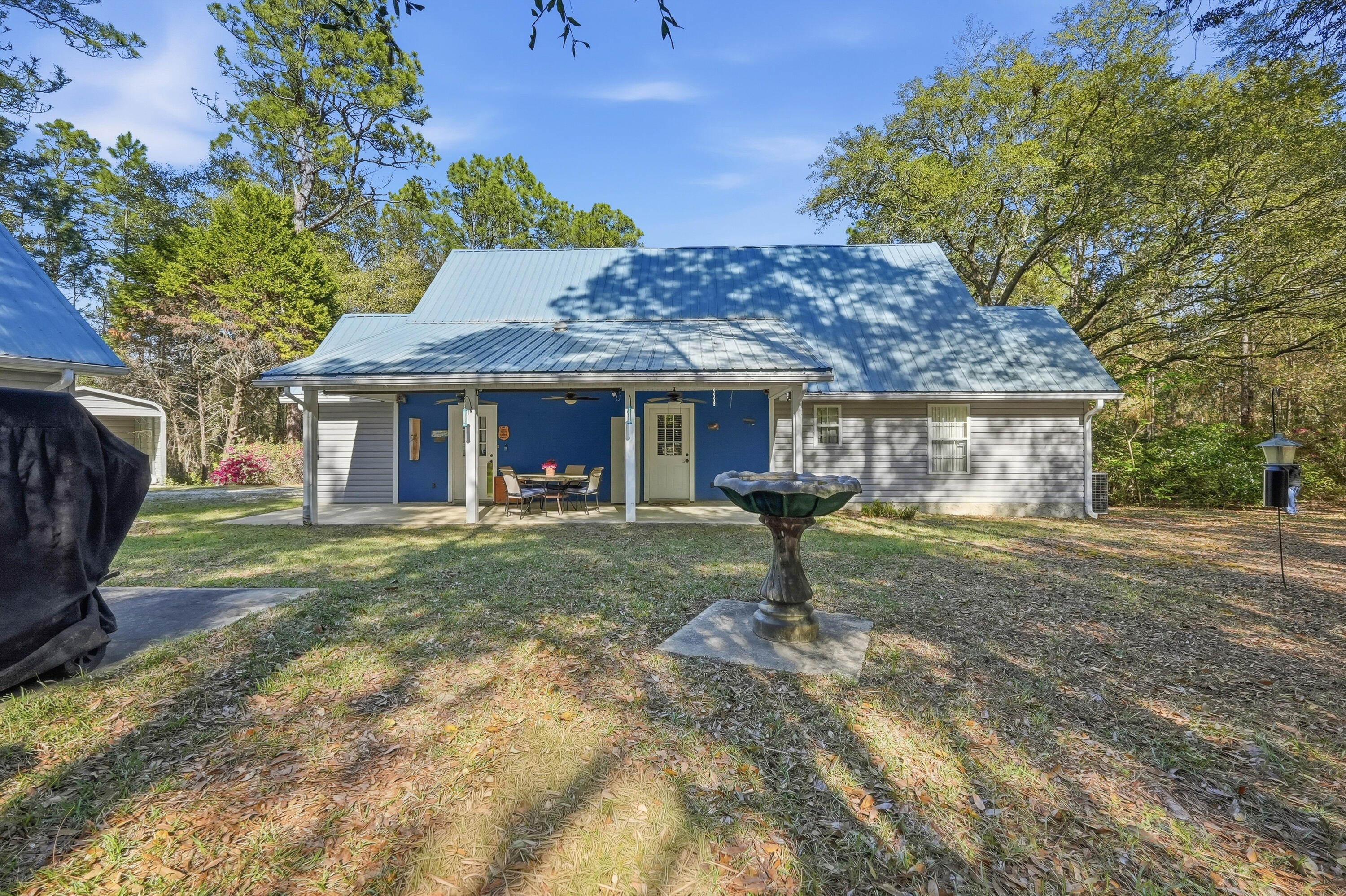 675 Spring Lake Road DeFuniak Springs, FL 32433 - Photo 72 of 91 a view of a house with a yard and sitting area