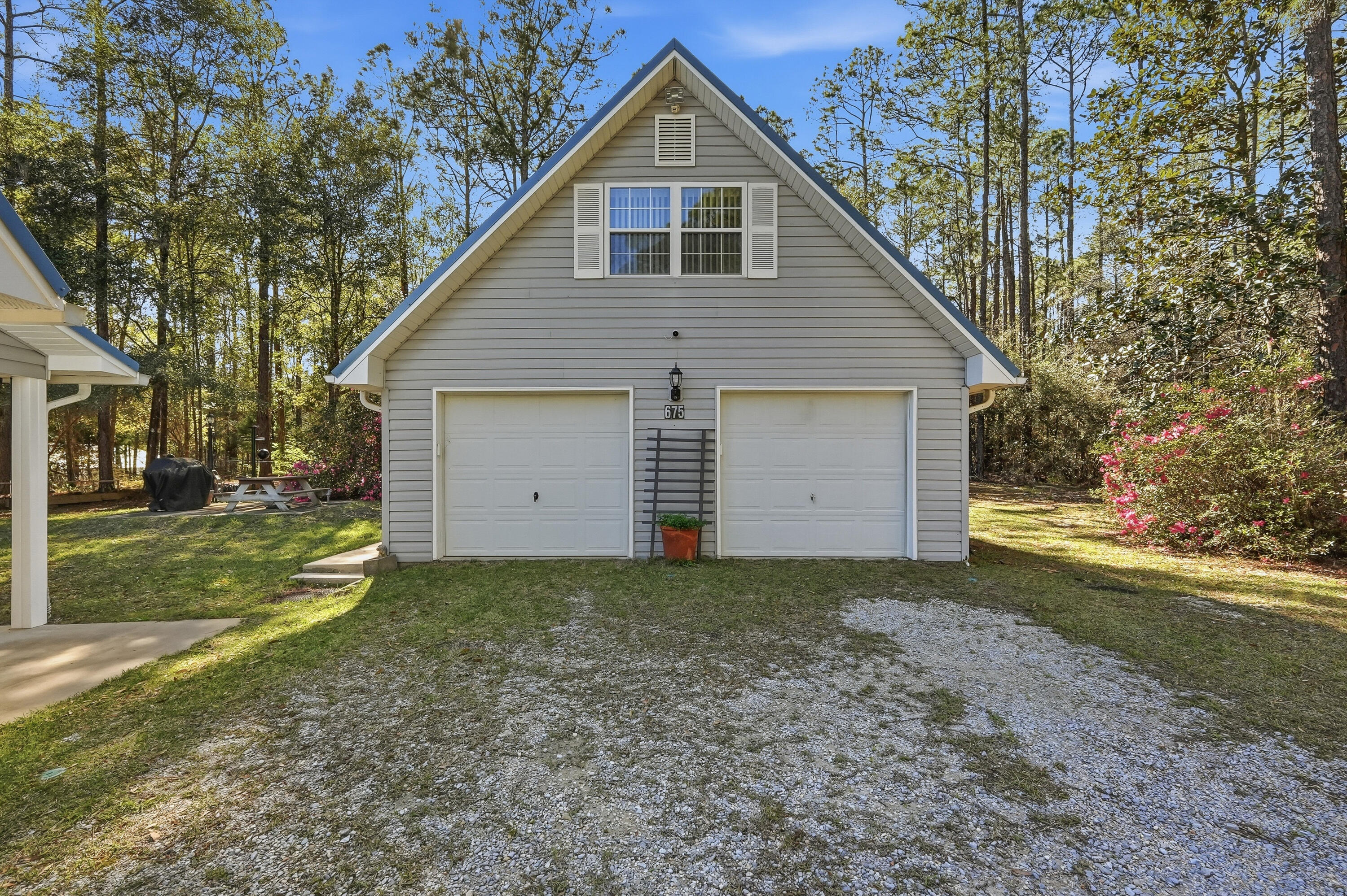 675 Spring Lake Road DeFuniak Springs, FL 32433 - Photo 74 of 91 a view of a house with a yard and large tree