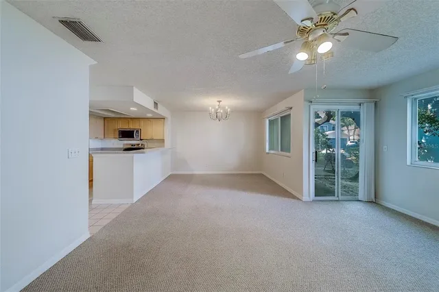 a view of a kitchen with a sink cabinets and a window