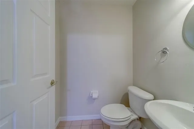 a view of a chandelier fan and entryway