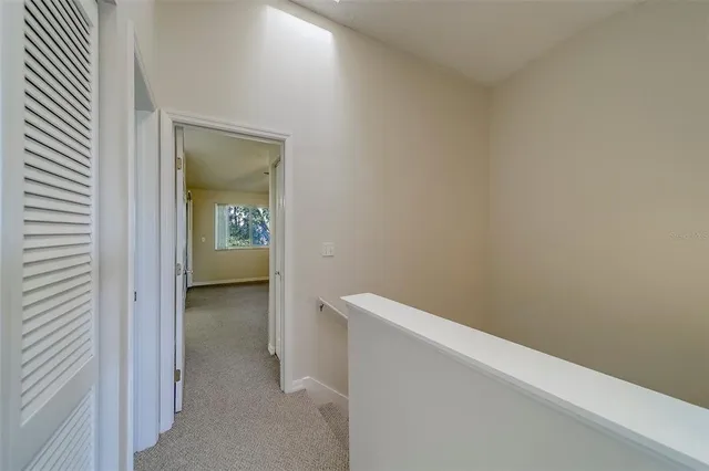a bathroom with a granite countertop toilet and a mirror