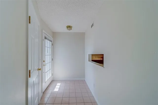 a kitchen with a sink and a mirror
