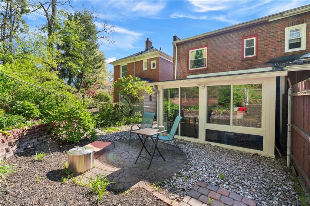 229 Dewey Street Pittsburgh, PA 15218 - Photo 14 of 33 a view of a patio with table and chairs and potted plants