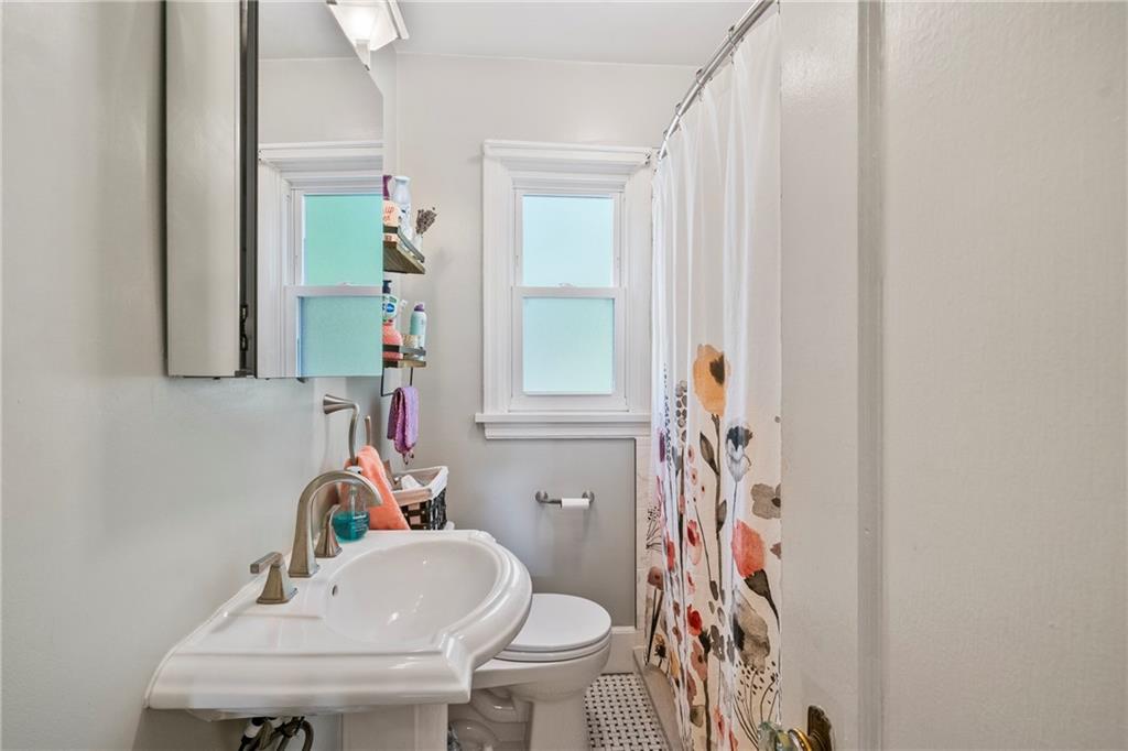 229 Dewey Street Pittsburgh, PA 15218 - Photo 17 of 33 a bathroom with a sink toilet and shower