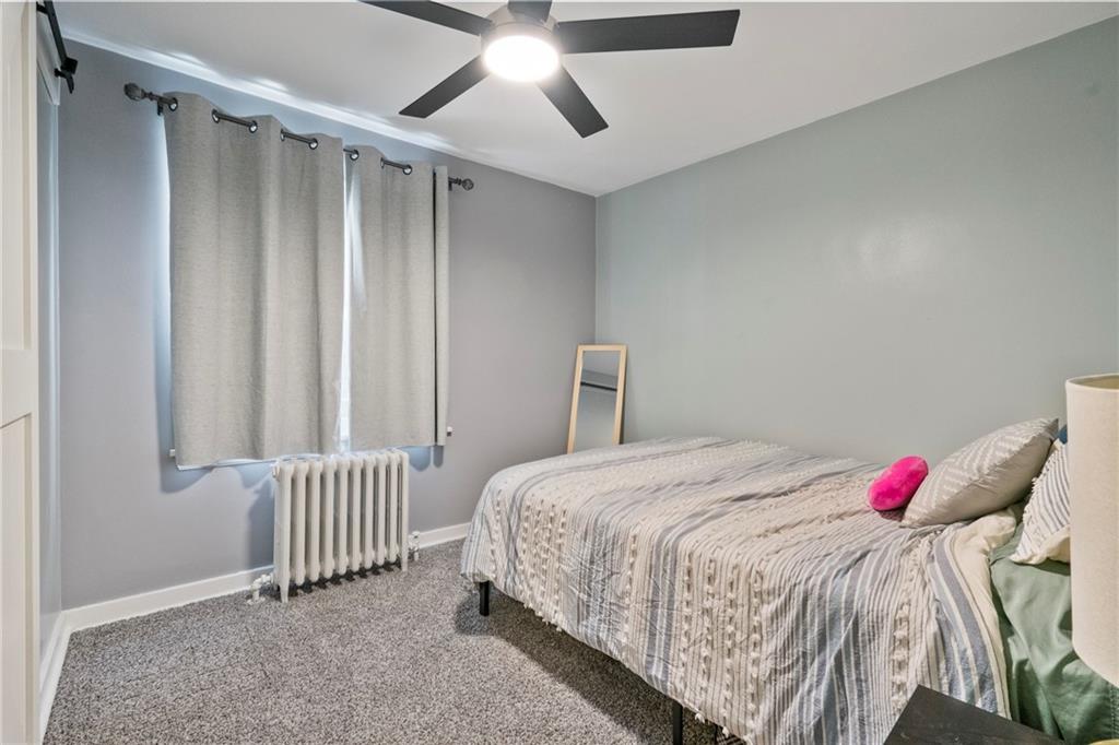 229 Dewey Street Pittsburgh, PA 15218 - Photo 20 of 33 a bedroom with a bed and a window