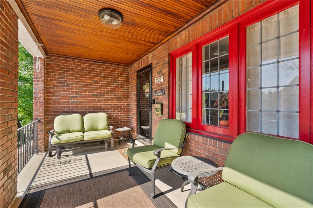 229 Dewey Street Pittsburgh, PA 15218 - Photo 2 of 33 a balcony with furniture and a potted plant