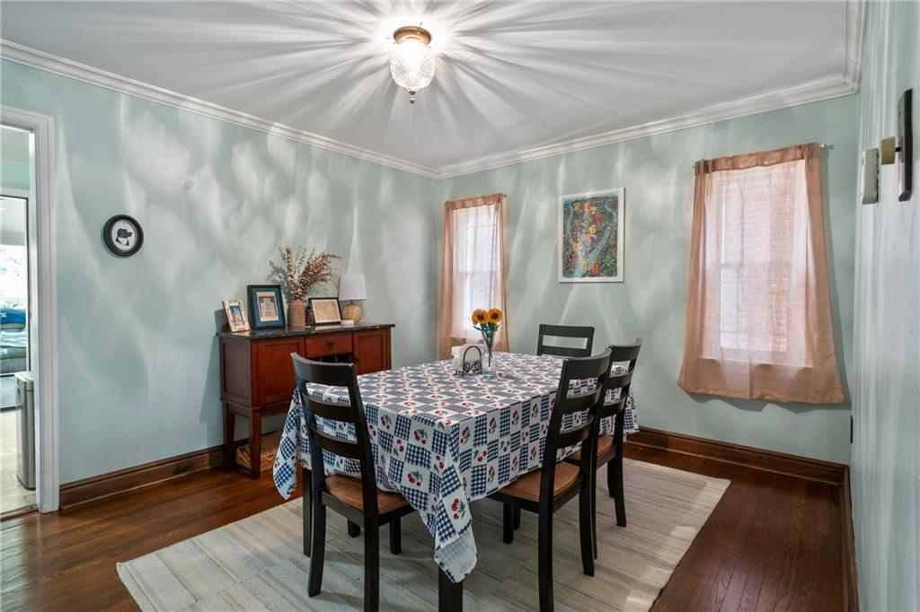 229 Dewey Street Pittsburgh, PA 15218 - Photo 8 of 33 a view of a dining room with furniture window and wooden floor