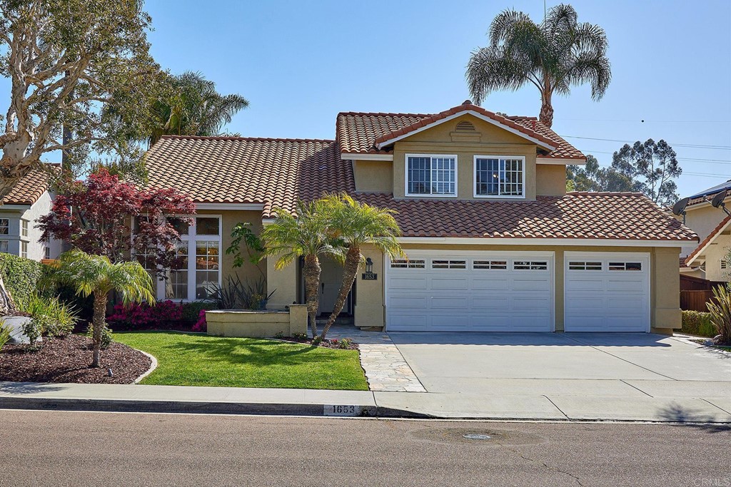 1653 Willowhaven Road Encinitas, CA 92024 - Photo 1 of 1 a front view of a house with a garden and plants