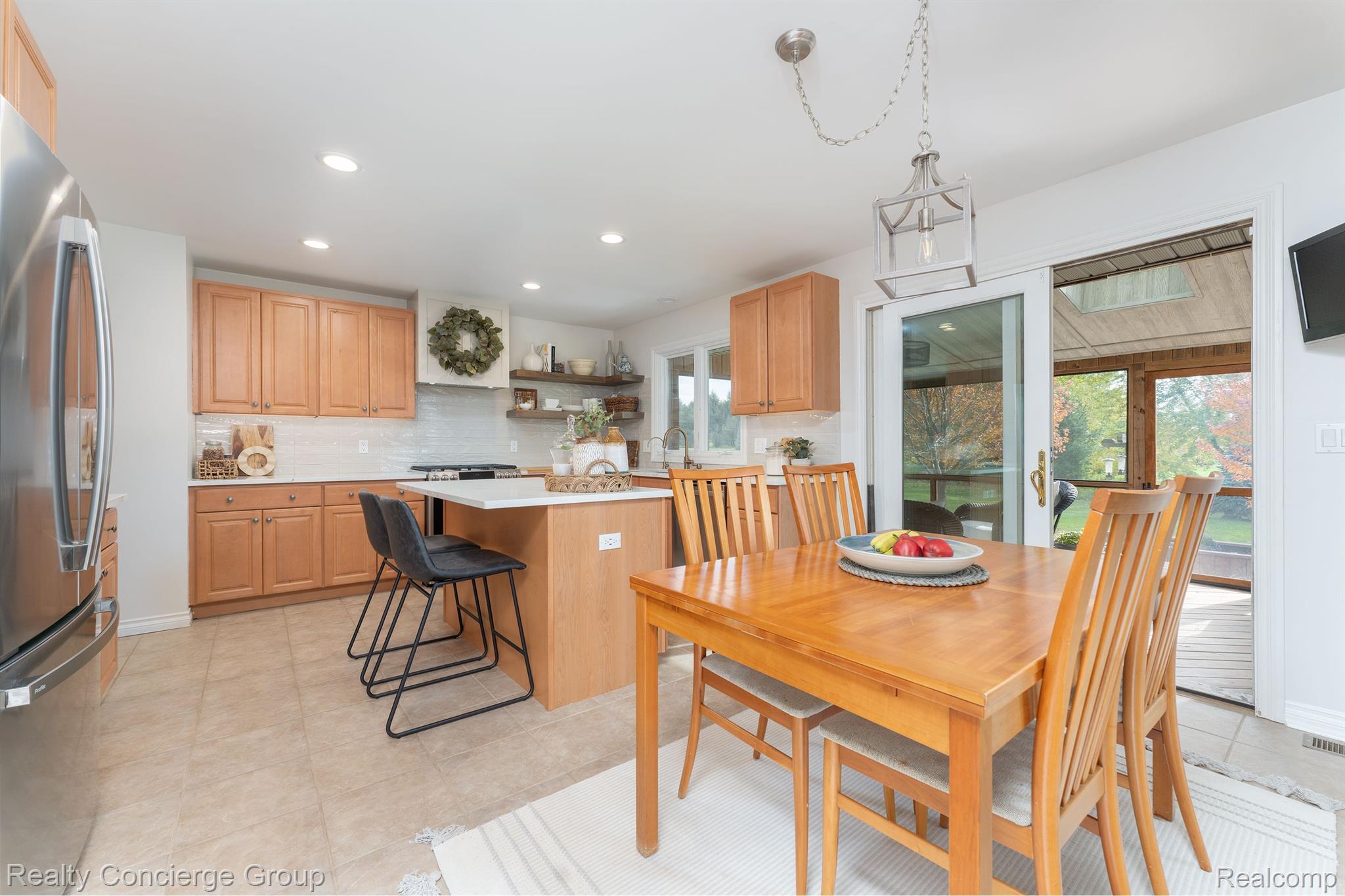 1172 Thorn Ridge Drive Howell, MI 48843 - Photo 17 of 71 Dining area extends to sunroom, w/ beautiful views