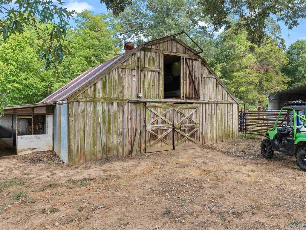6006 Highway 315 Carthage, TX 75633 - Photo 19 of 35 a view of backyard with small cabin