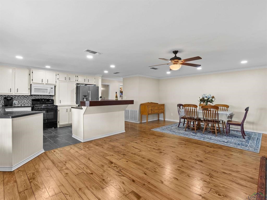 6006 Highway 315 Carthage, TX 75633 - Photo 20 of 35 a kitchen with stainless steel appliances kitchen island granite countertop a sink and cabinets
