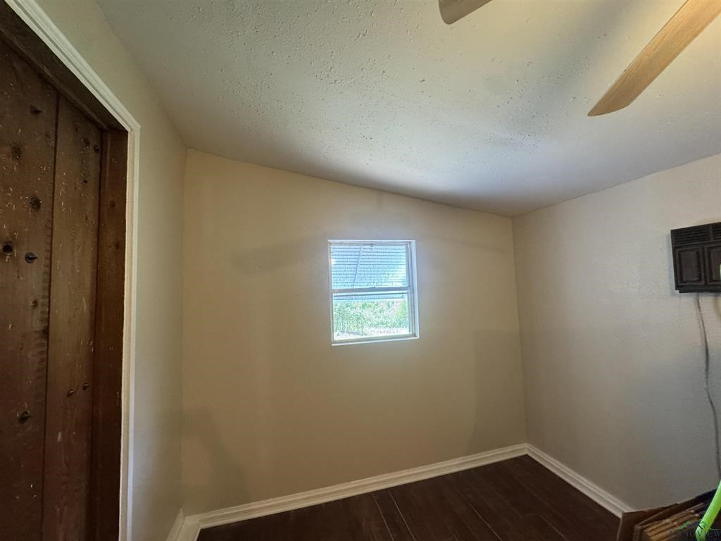 6006 Highway 315 Carthage, TX 75633 - Photo 23 of 35 a view of a room with wooden floor and windows