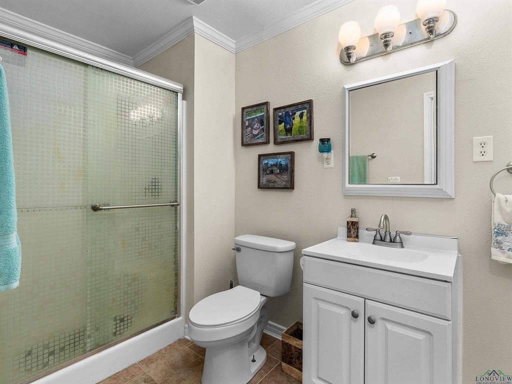 6006 Highway 315 Carthage, TX 75633 - Photo 29 of 35 a bathroom with a sink toilet and shower