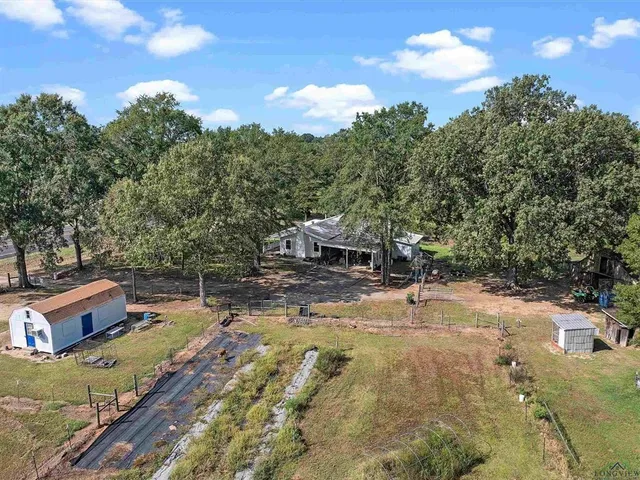 a view of a swimming pool with a yard