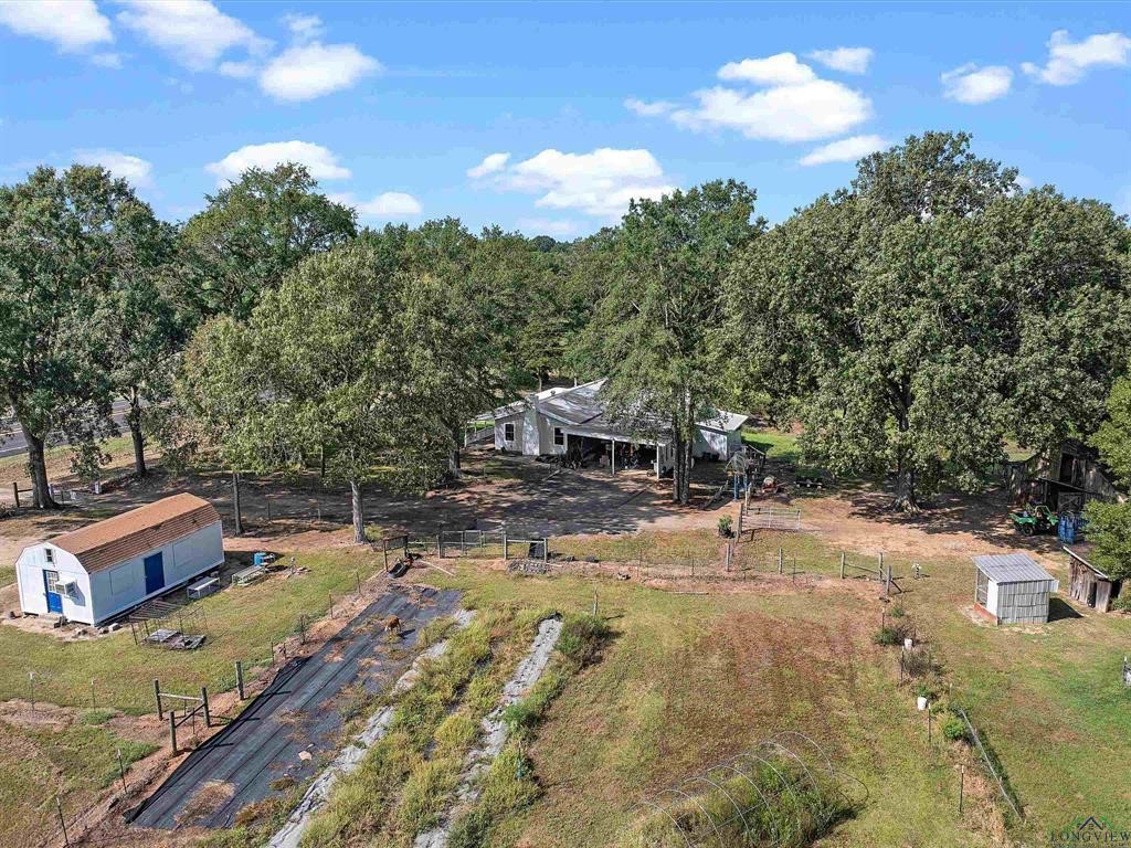 6006 Highway 315 Carthage, TX 75633 - Photo 33 of 35 a view of a swimming pool with a yard