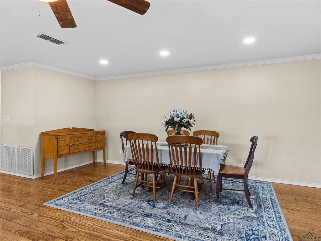 6006 Highway 315 Carthage, TX 75633 - Photo 6 of 35 a dining room with furniture and wooden floor